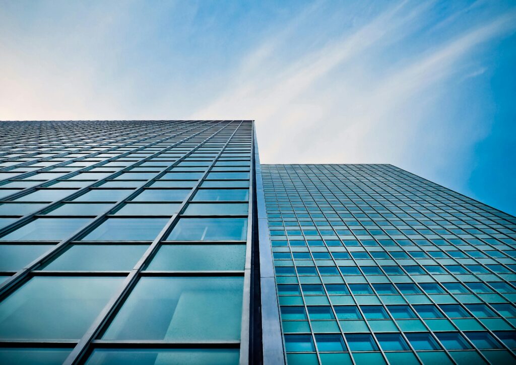 Photo of Low Angle View of Office Building Against Blue Sky by Pixaby at Pexels