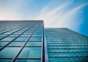 Photo of Low Angle View of Office Building Against Blue Sky by Pixaby at Pexels